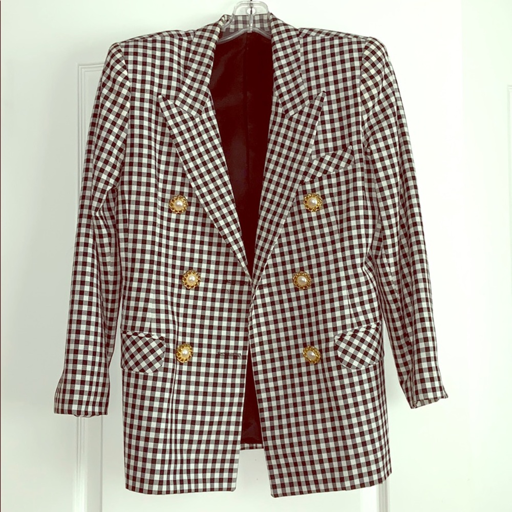 Black and white suit jacket with gold buttons